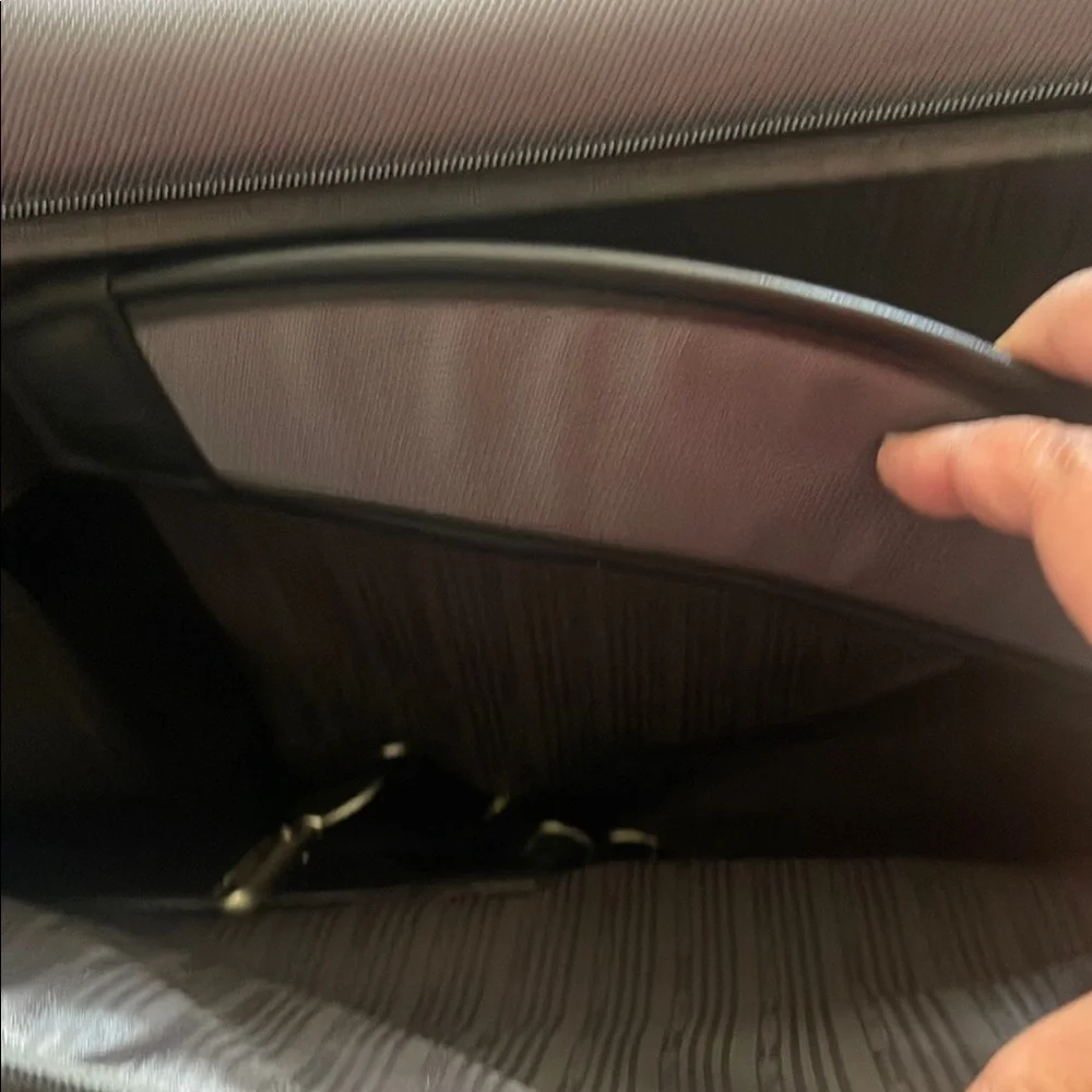 Black and Gray Travel Bags with Metal Accents